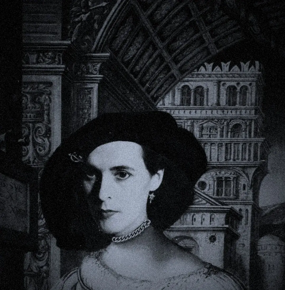 Black-and-white portrait of Kati Horna in a hat against photomontaged architecture